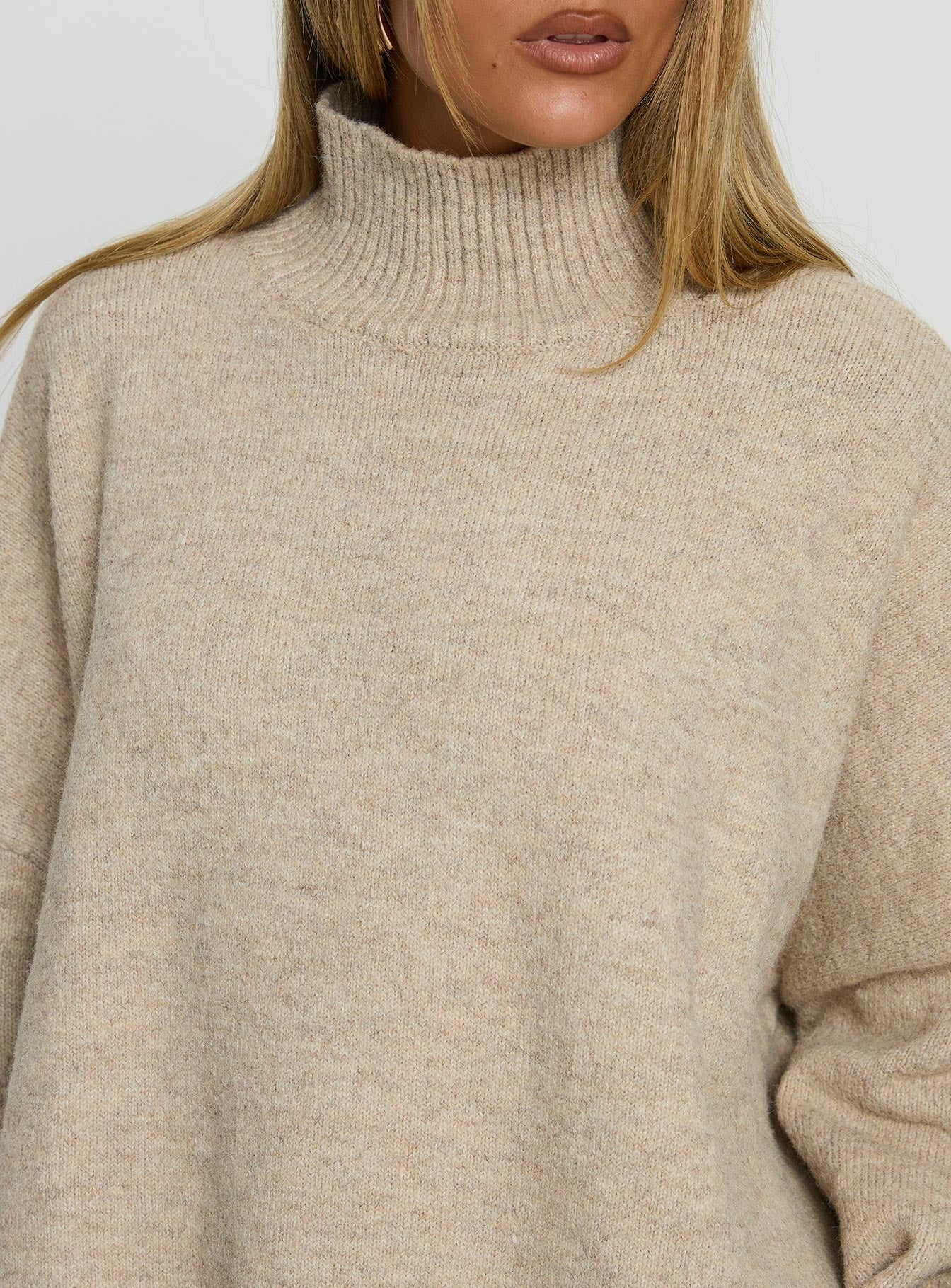 back view of model wearing Princess Polly Patrizia Funnel Neck Knit Sweater Beige 
