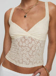 Front view of model wearing  front Princess Polly Sleeveless Plunger  Wandella Top Cream