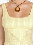 Crop top, square neckline Fixed shoulder straps, zip fastening at back