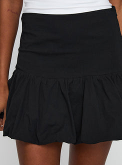 back view of model wearing Princess Polly Leilana Bubble Hem Mini Skirt Black Mini Skirts 