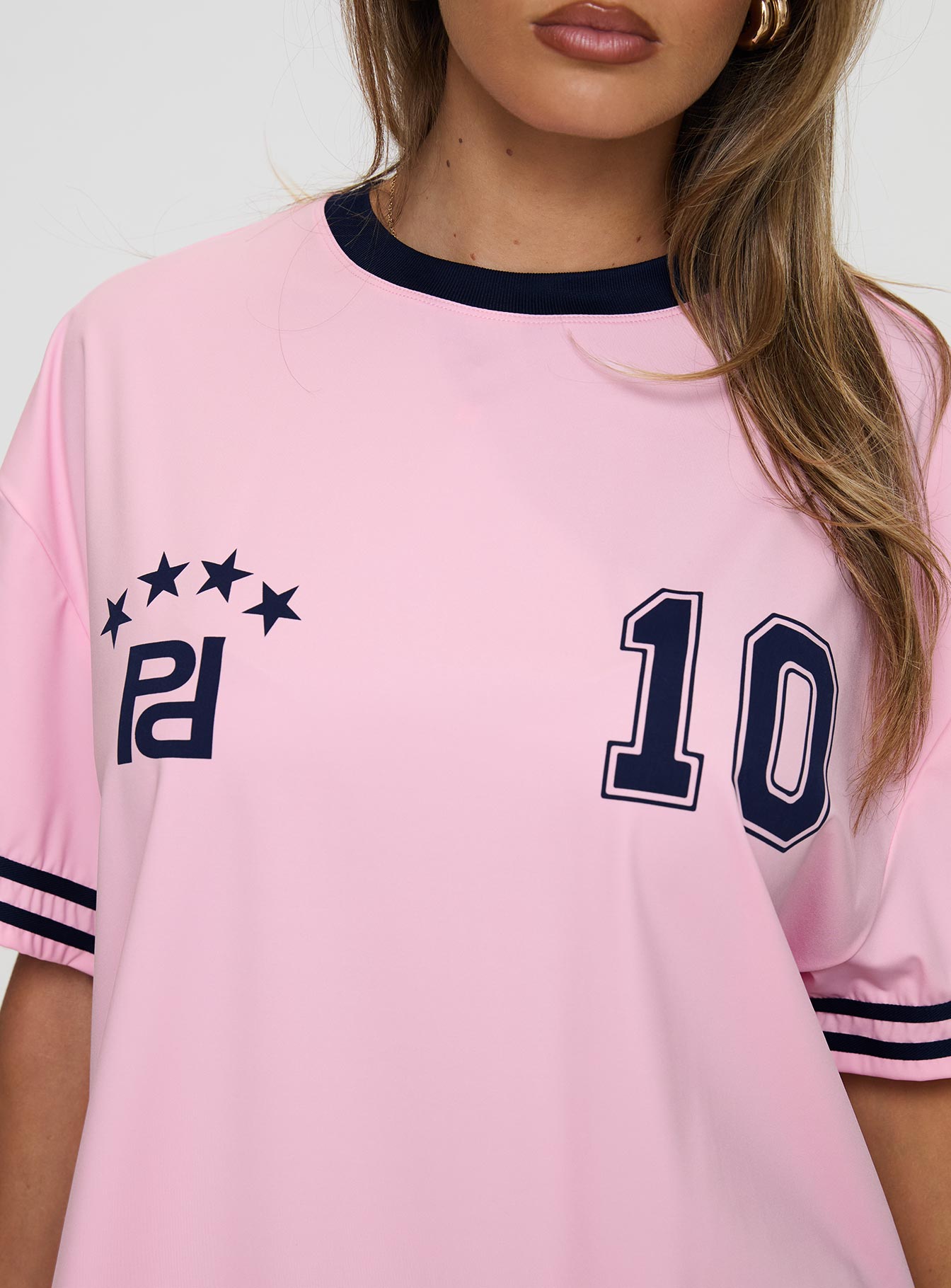 back view of model wearing Princess Polly Cornwall Football Jersey Pink Half Sleeves Crew Neck 
