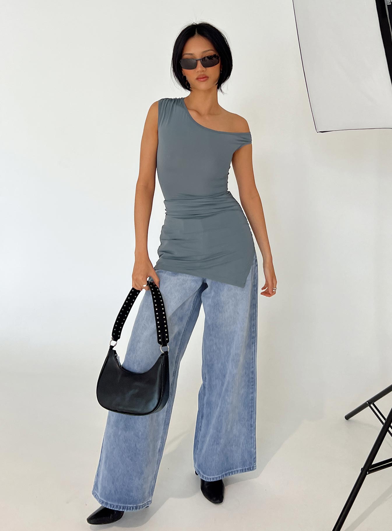 Front view of model wearing  front Princess Polly High Neck  Ragan One Shoulder Mini Dress Grey