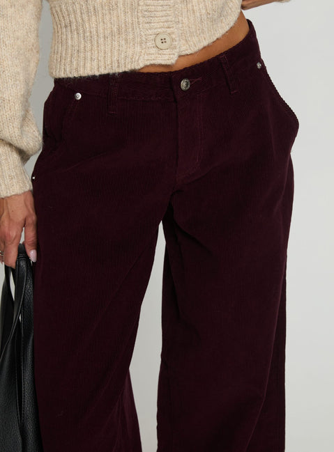 back view of model wearing Princess Polly Jacynda Low Waist Wide Leg Corduroy Jeans Currant Mid Rise Jeans 