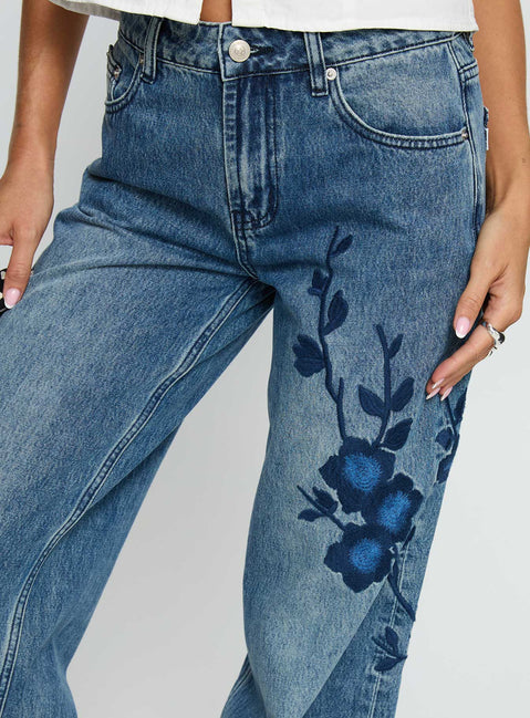 front view of model wearing Princess Polly Sisterhood Mid Rise Wide Leg Patchwork Jeans Mid Blue Wash Mid Rise Jeans 