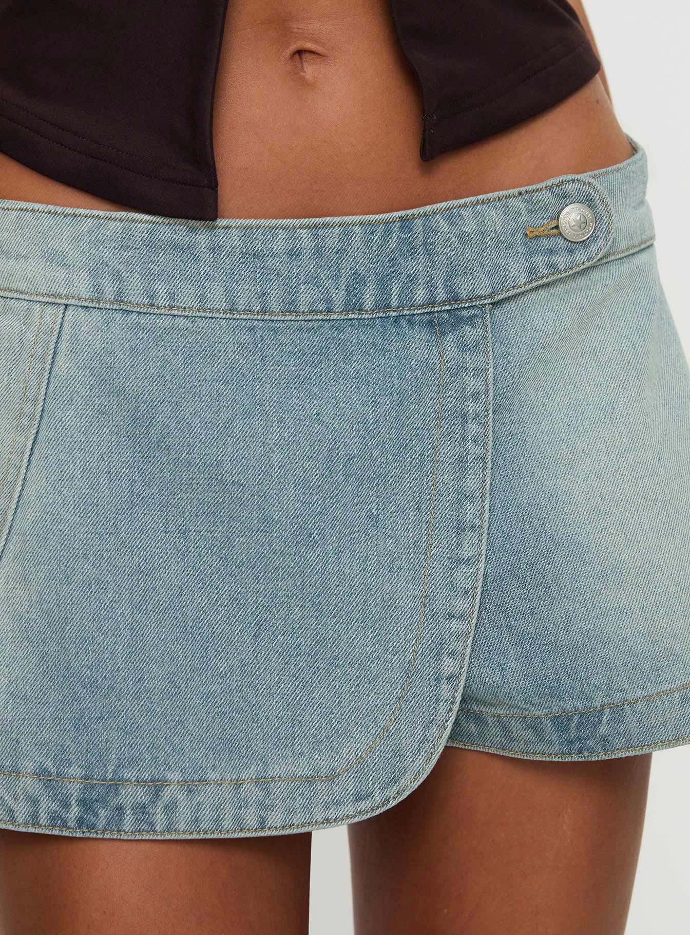front view of model wearing Princess Polly Down For The Ride Denim Skort Light Wash Tall 