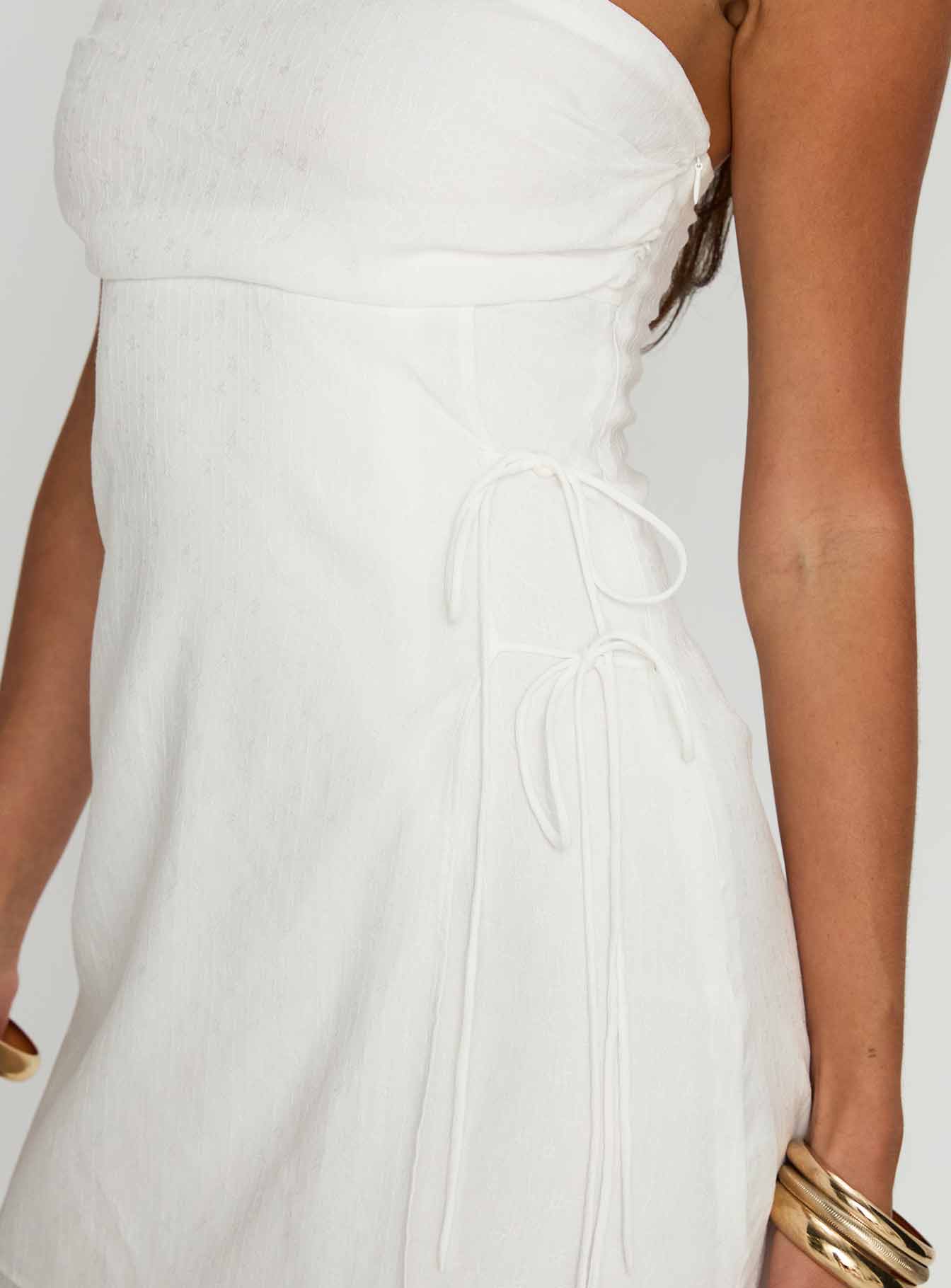 back view of model wearing Princess Polly New Beginnings Strapless Mini Dress White Straight Neck 