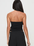 Strapless top Inner silicone strip at bust, twin buckle detail, asymmetric hem Good stretch, unlined 
