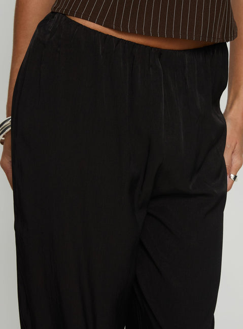 side view of model wearing Princess Polly Breina Satin Straight Leg Pants Black High Rise Pants 