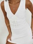 side view of model wearing Princess Polly Bernier Mini Dress White V-Neck 