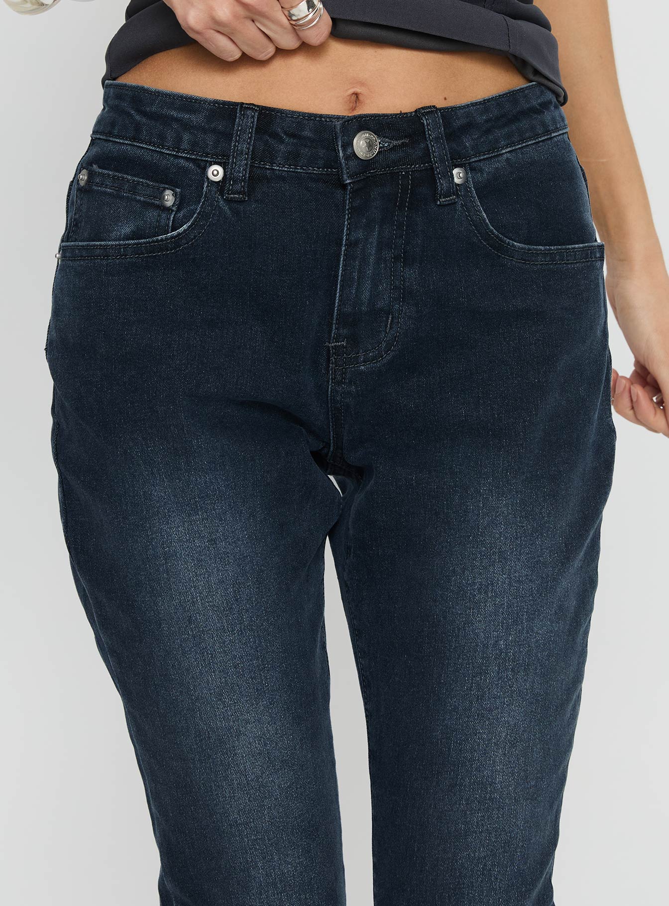 back view of model wearing Princess Polly Illyssa Mid Rise Skinny Jeans Washed Charcoal Mid Rise Jeans 