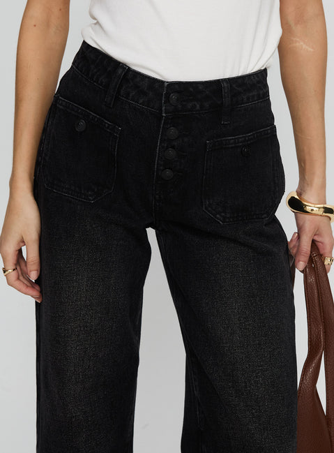 back view of model wearing Princess Polly Carianne Low Rise Wide Leg Jeans Washed Black Mid Rise Jeans 