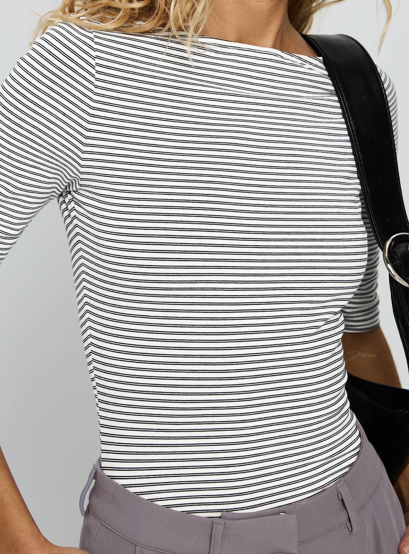 side view of model wearing Princess Polly Here One Moment 3/4 Sleeve Bodysuit Black / White Stripe Half Sleeve 