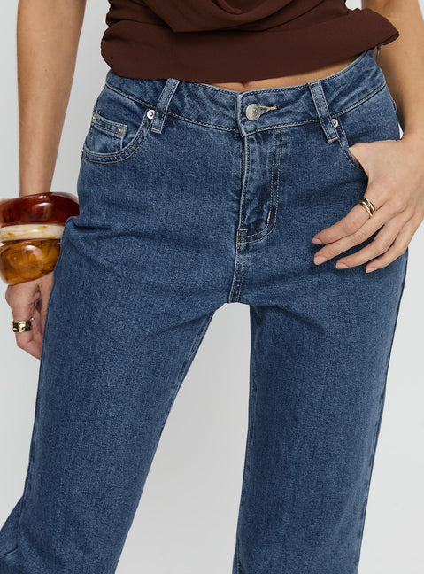 front view of model wearing Princess Polly Magic Mirror Mid Rise Bootleg Jeans Mid Blue Wash Mid Rise Jeans 