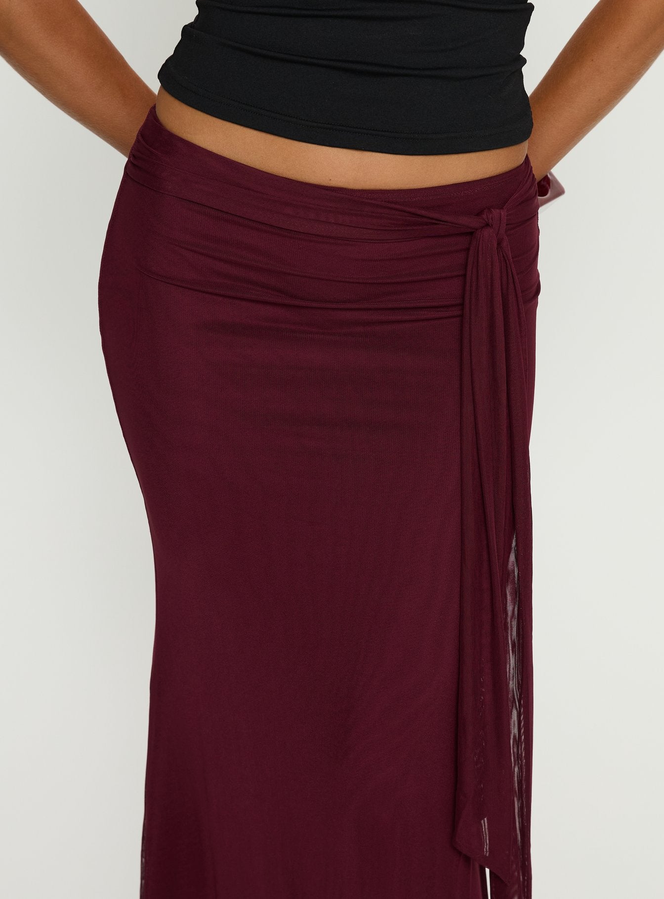 back view of model wearing Princess Polly Caviar Tie Maxi Skirt Currant Maxi Skirts 