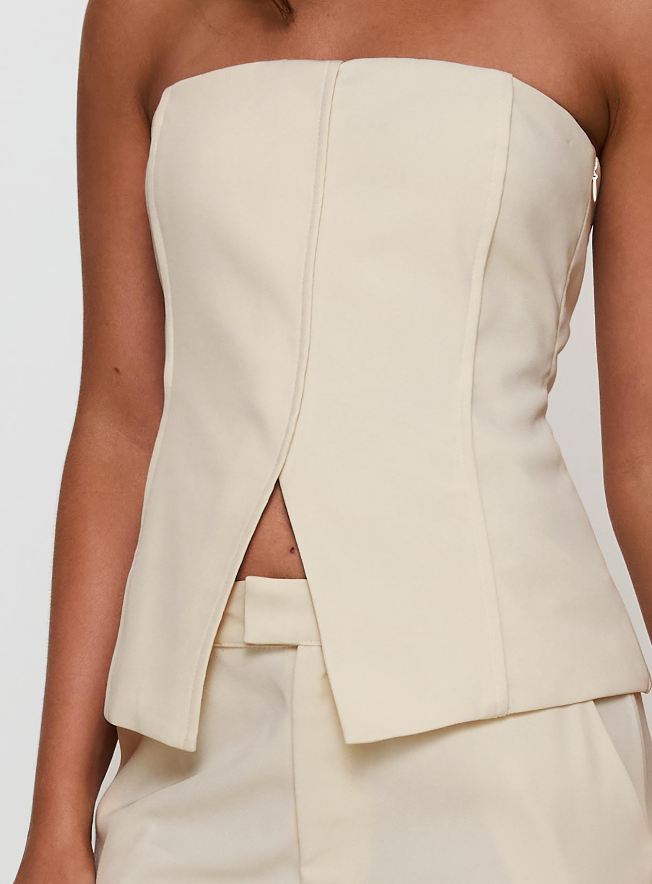 back view of model wearing Princess Polly Lavish Living Strapless Top Cream Sleeveless straight 