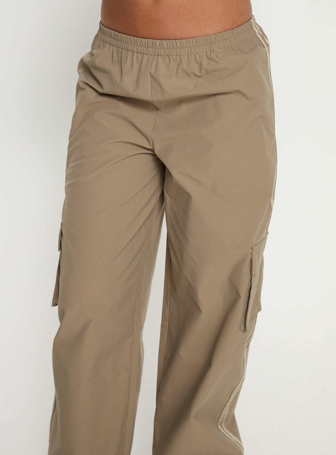side view of model wearing Princess Polly Ellyn Baggy Cargo Pants Khaki Mid Rise Pants 