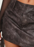 back view of model wearing Princess Polly Domenic Faux Leather Mini Skirt Washed Black Tall Mini Skirts 