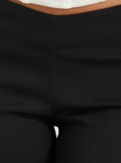 Showcasing the Zeni V Waist Bootleg Pants Black womens-regular-pants in mid-rise product view of model wearing