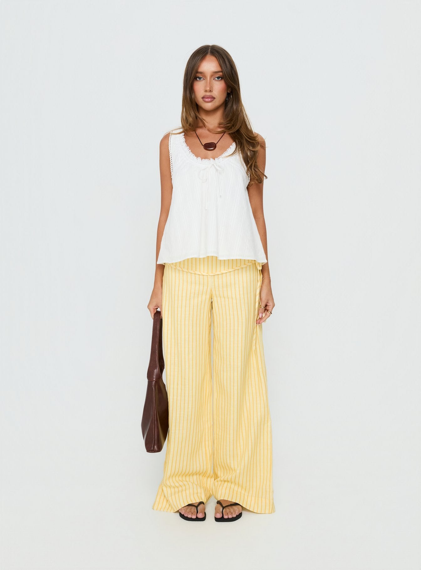 front view of model wearing Princess Polly Silver Moon Pants Yellow Stripe Low Rise Pants 