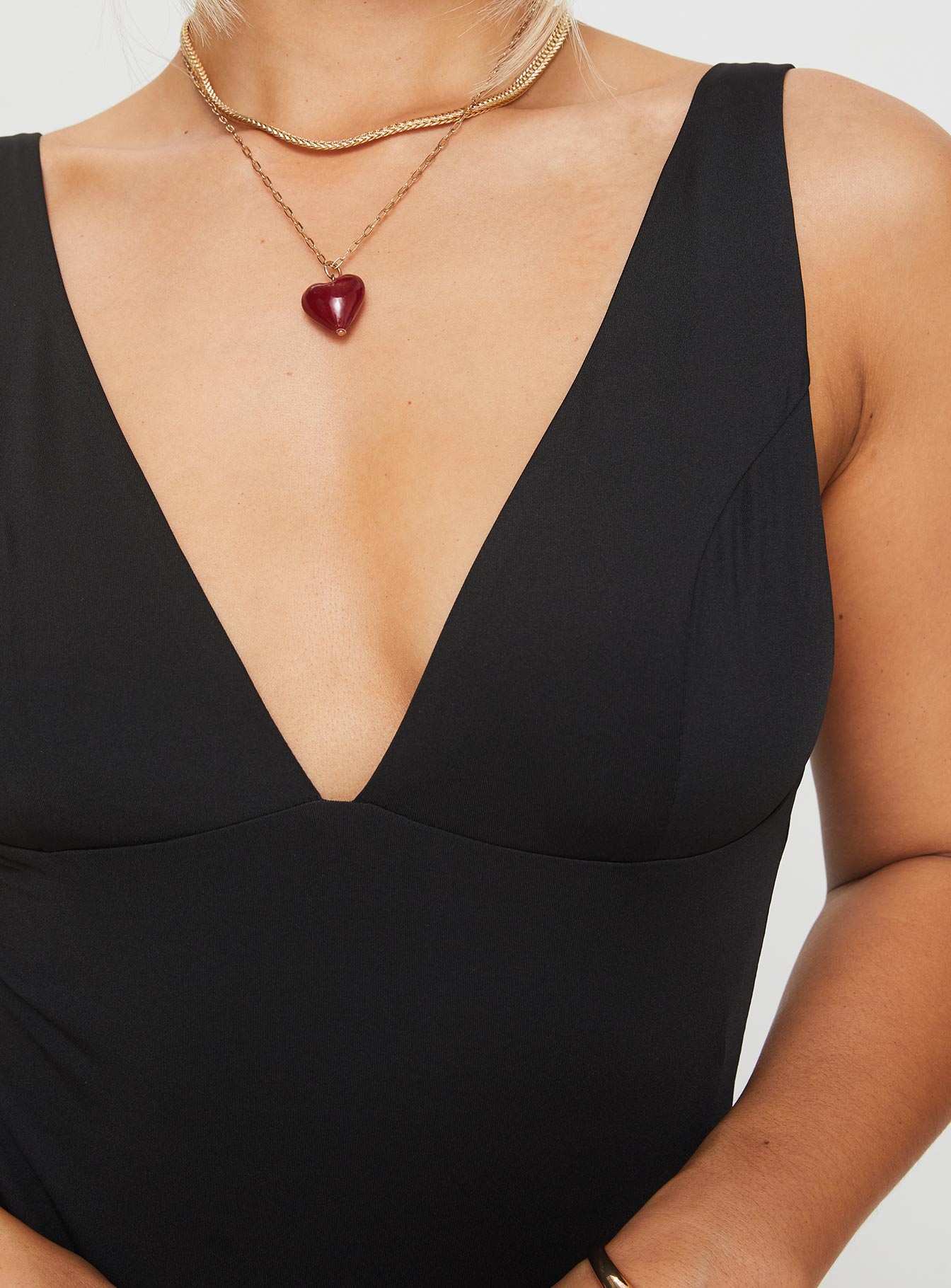 back view of model wearing Princess Polly Enid Bodysuit Black Sleeveless Plunger 