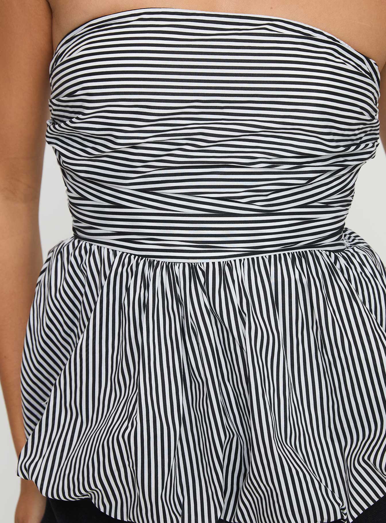 back view of model wearing Princess Polly Selenea Bubble Hem Top Black / White Sleeveless straight 