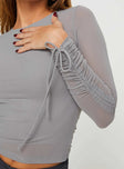 Long sleeve mesh top High neckline, adjustable ruching at sleeves with tie fastening