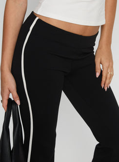 back view of model wearing Princess Polly Simki Jersey Flare Pants Black Low Rise Pants 