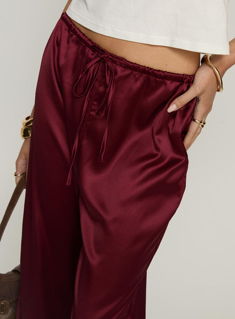 side view of model wearing Princess Polly Soulstar Satin Pants Wine Mid Rise Pants 