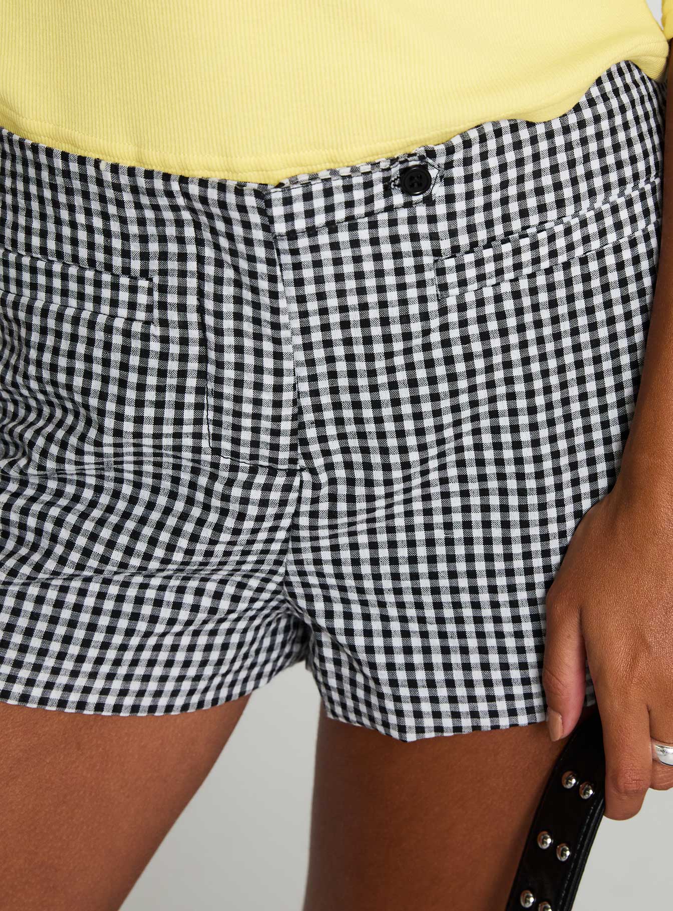 back view of model wearing Princess Polly Hot Commodity Micro Shorts Black Gingham Low Rise Shorts 