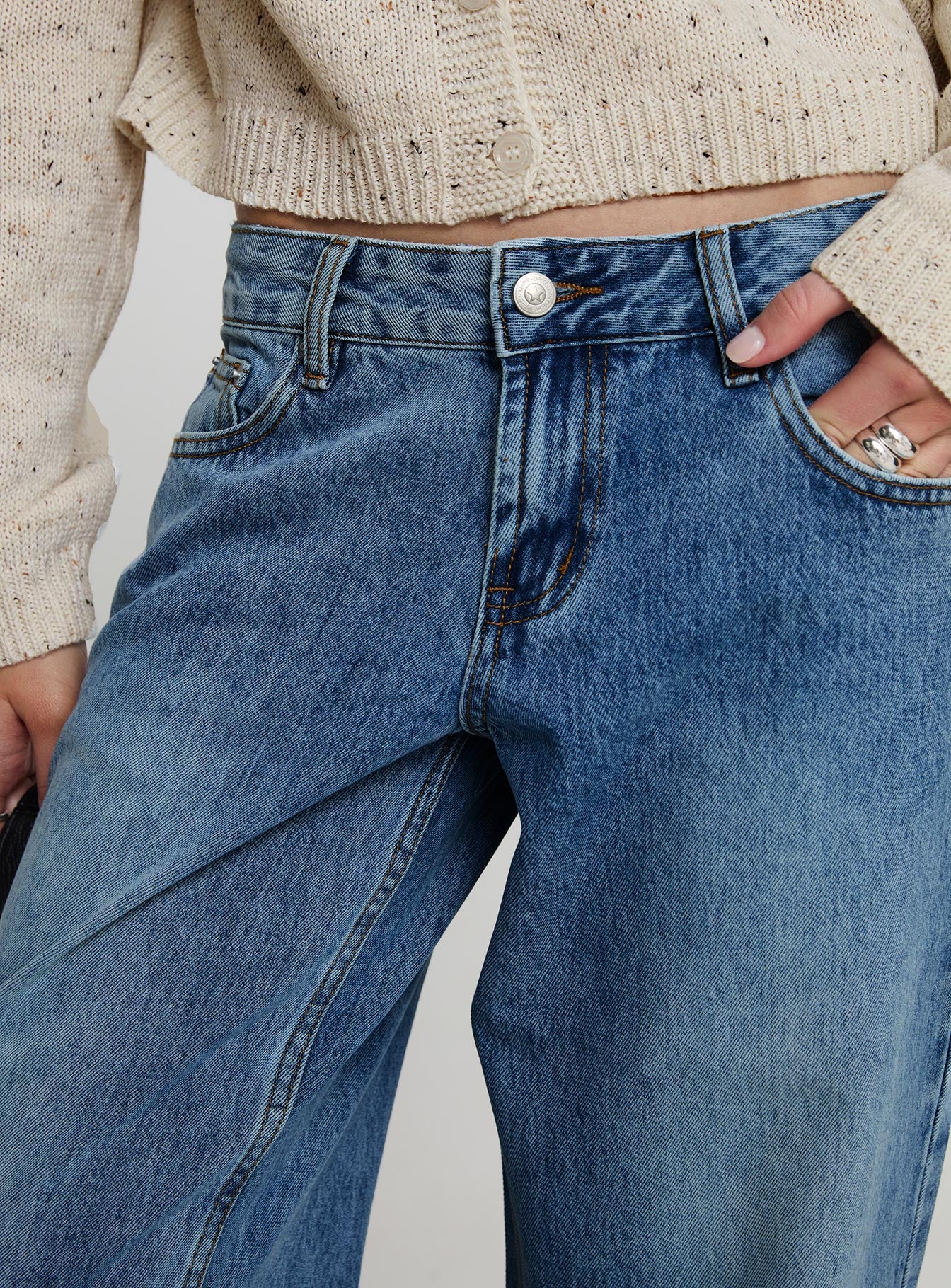 side view of model wearing Princess Polly Sabryna Low Rise Jeans Blue Low Rise Jeans 