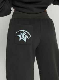 side view of model wearing Princess Polly Princess Polly Stargirl Wide Leg Sweat Pants Charcoal High Rise Pants 