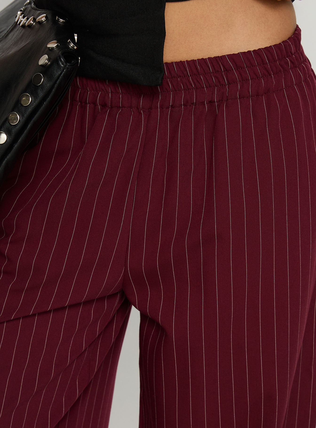 back view of model wearing Princess Polly Jaysa Baggy Wide Leg Pant Burgundy Pinstripe Mid Rise Pants 