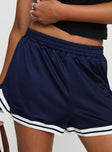 side view of model wearing Princess Polly Longer Days Short Navy High Waisted Shorts 