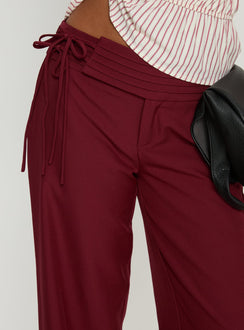back view of model wearing Princess Polly Good Riddance Pleat Tie Slouch Pants Burgundy Mid Rise Pants 
