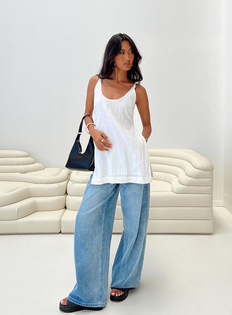Front view of model wearing  front Princess Polly Sleeveless Crew Neck  Zanzibar Top White