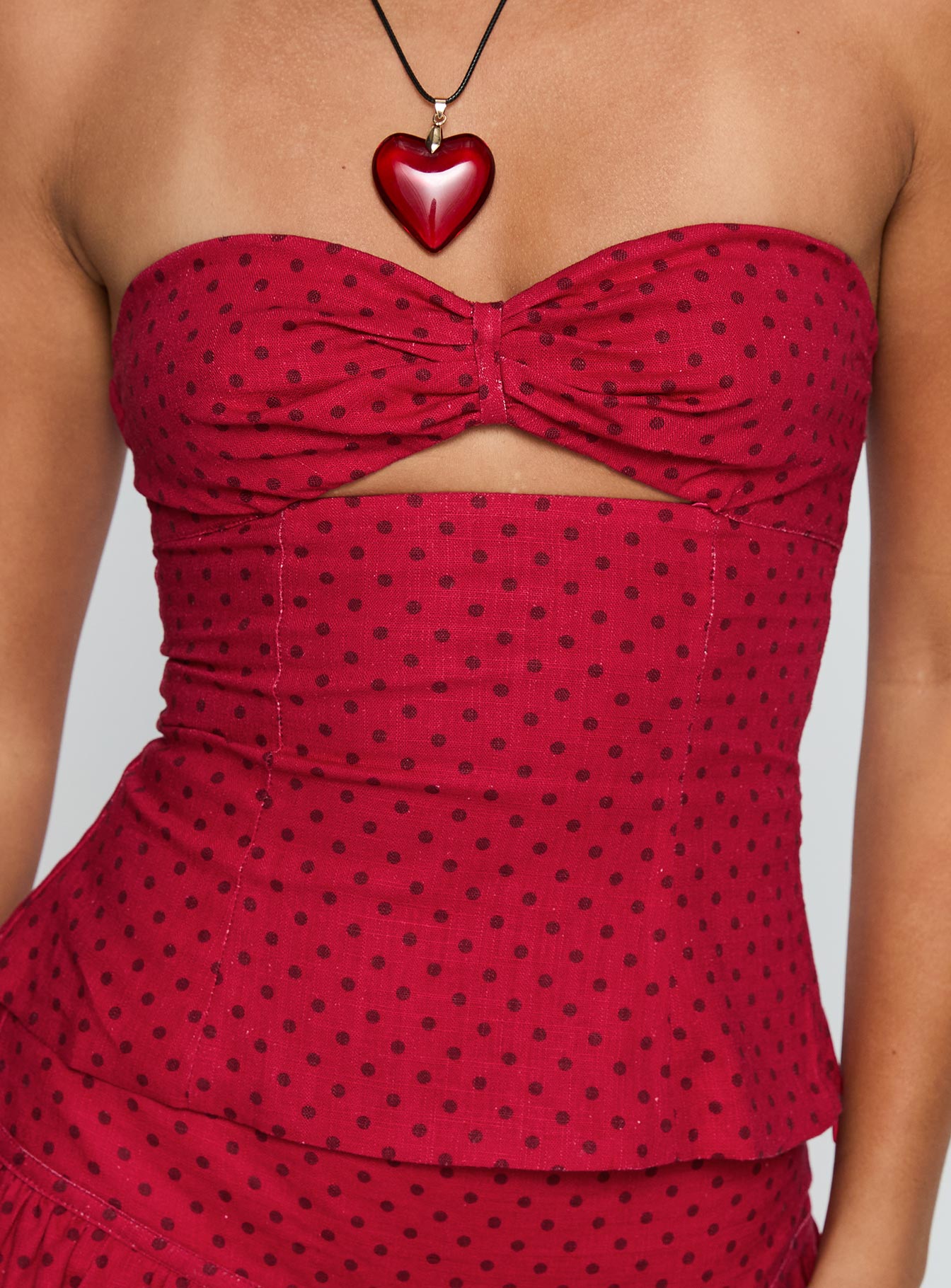 back view of model wearing Princess Polly Kandee Twist Linen Blend Top Red Polka Sleeveless Sweetheart 