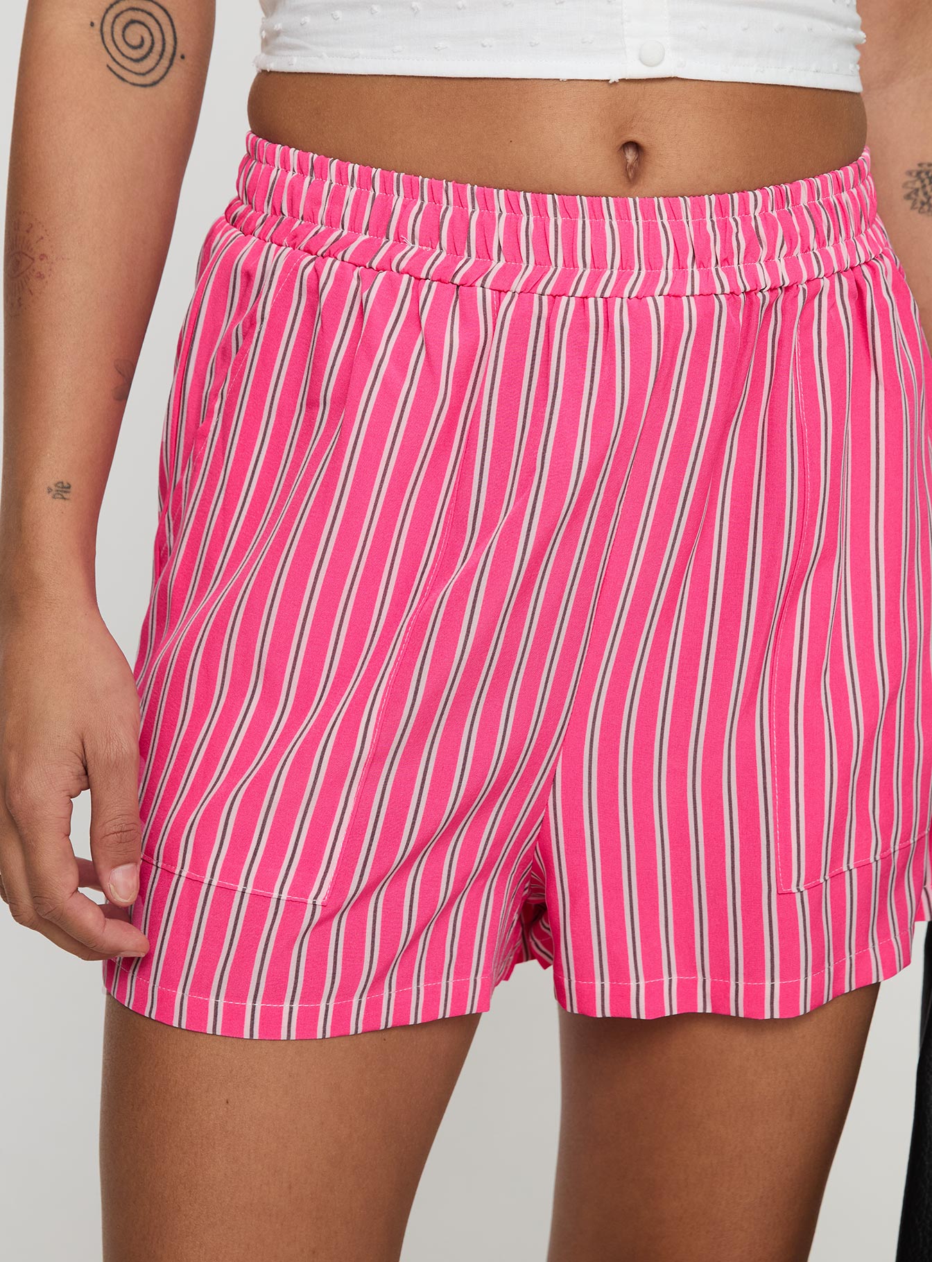back view of model wearing Princess Polly Miragea Shorts Hot Pink Stripe High Waisted Shorts 