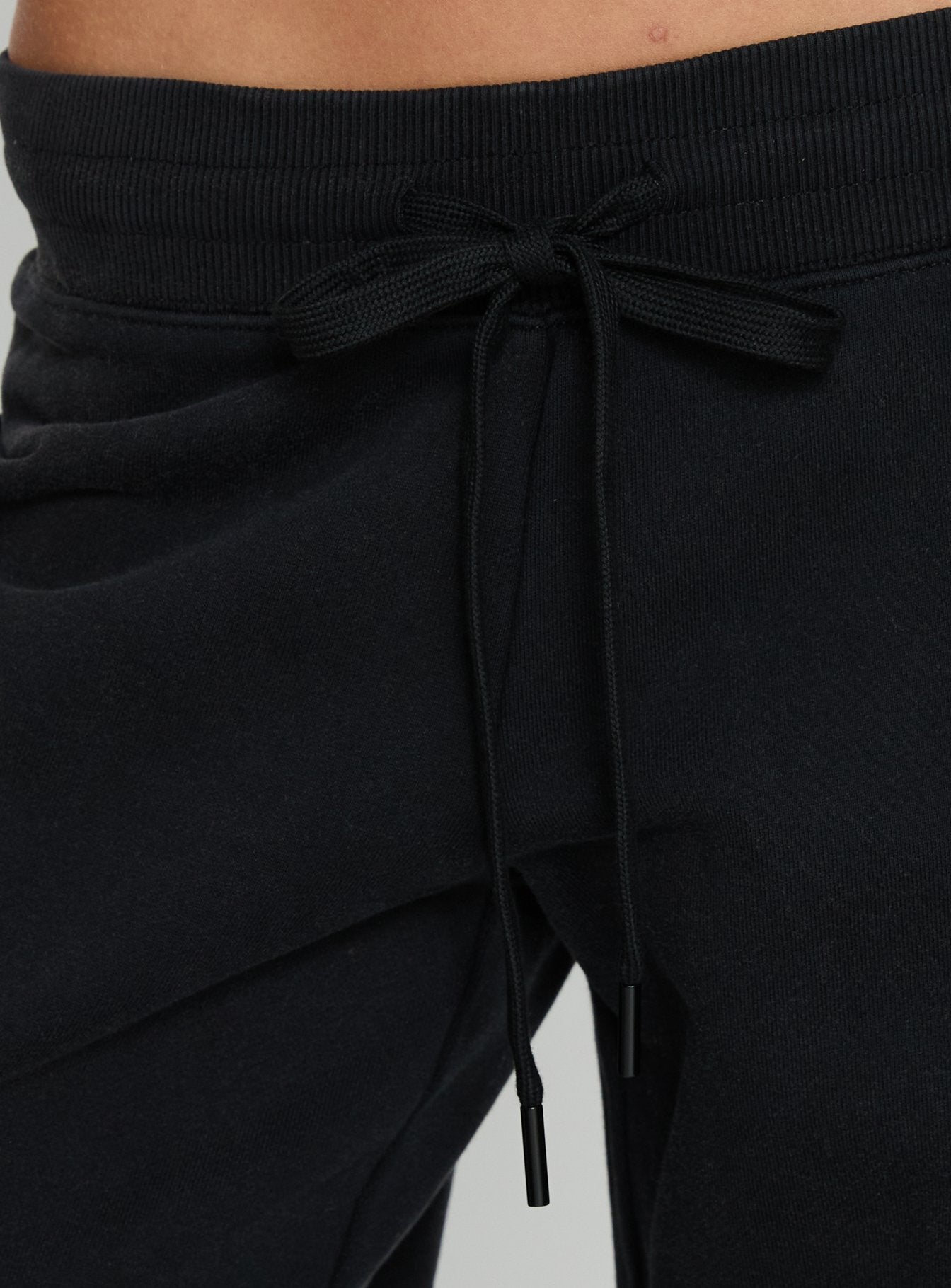 back view of model wearing Princess Polly Dodie Wide Leg Pants Washed Black Mid Rise Pants 