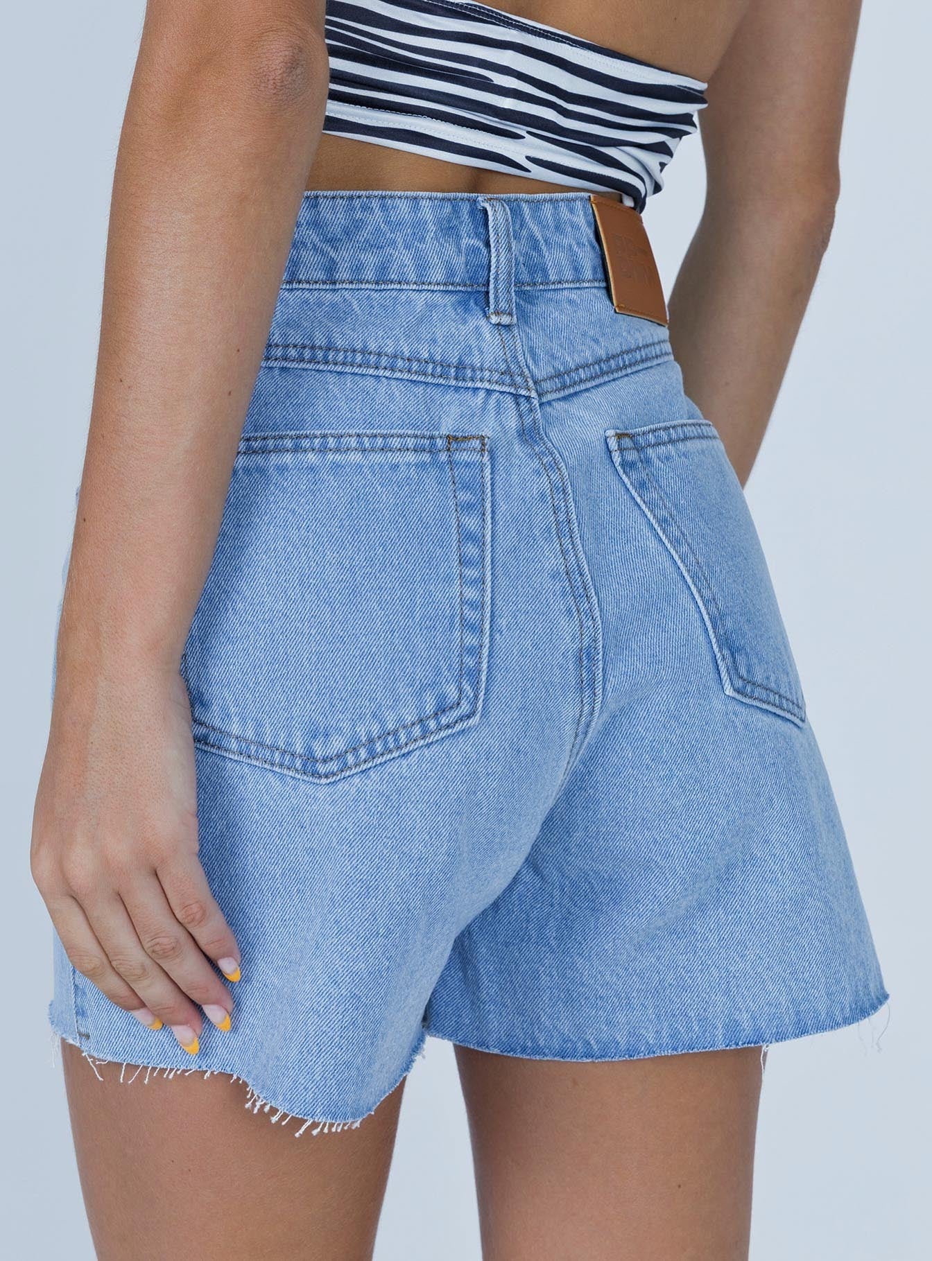 Front view of model wearing  front Laurena Denim Shorts Tall Princess Polly High Waisted Shorts 