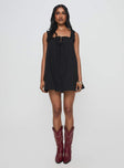 front view of model wearing Princess Polly Swing Mini Dress Black Petite Square Neck 