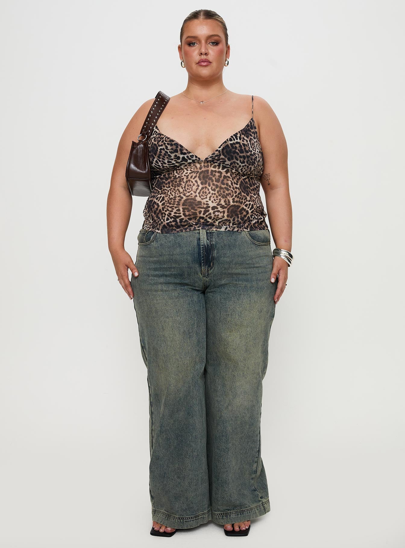 front view of model wearing Princess Polly Fast Times Top Leopard Curve Sleeveless Plunger 