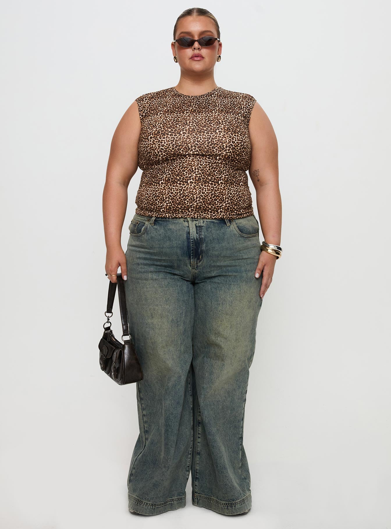 side view of model wearing Princess Polly Lure Top Leopard Curve Sleeveless Crew Neck 