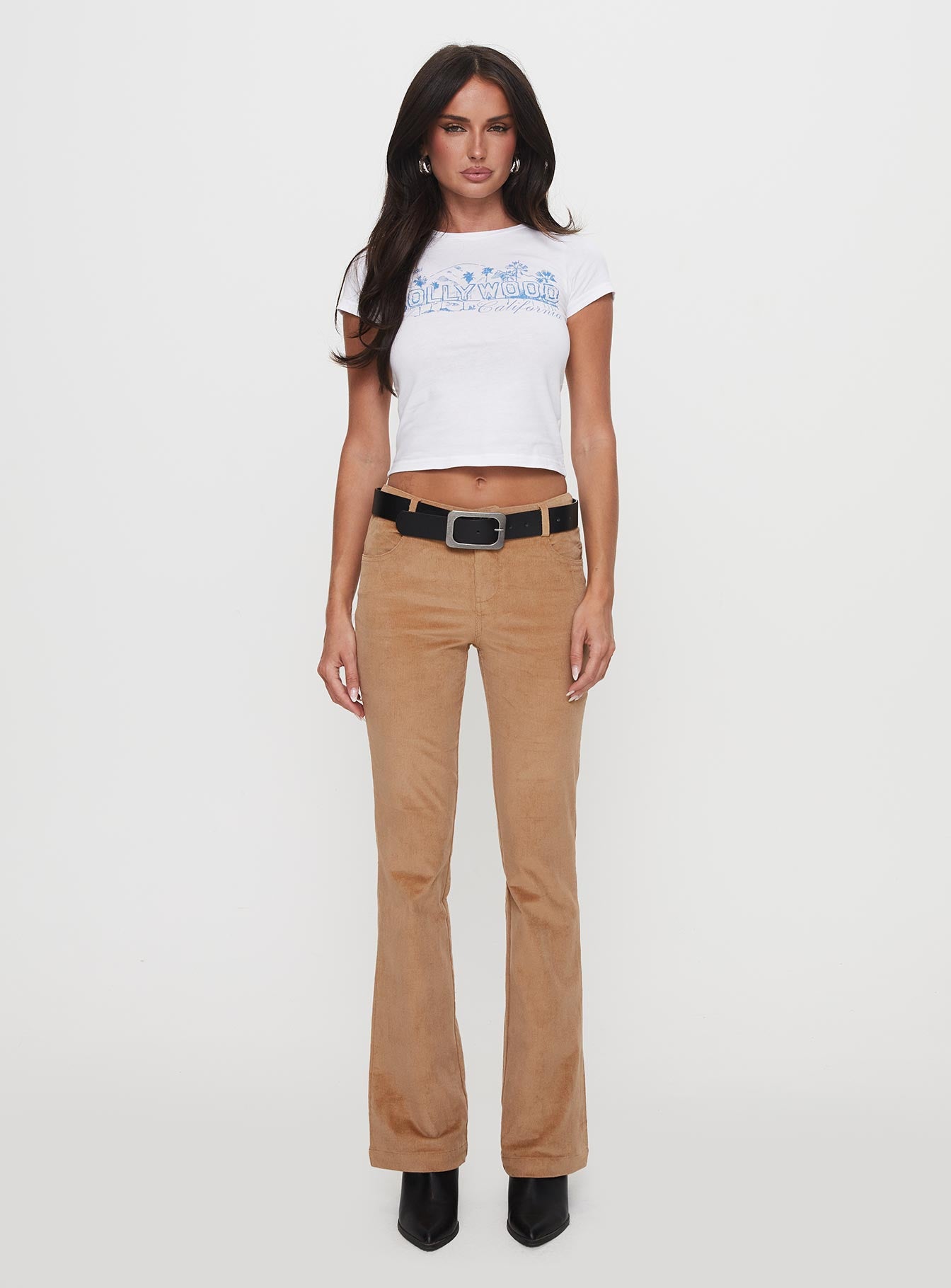 front view of model wearing Princess Polly Troubadour Low Waist Jeans Tan 