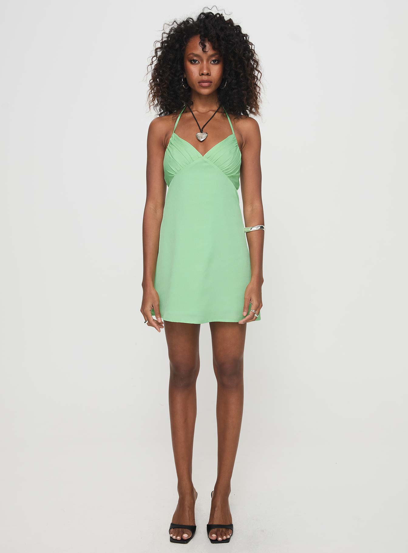 side view of model wearing Princess Polly Marciela Mini Dress Green V-Neck 