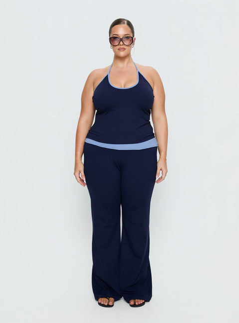 front view of model wearing Princess Polly Kobee Jersey Flare Pants Navy / Light Blue Curve High Rise Pants 