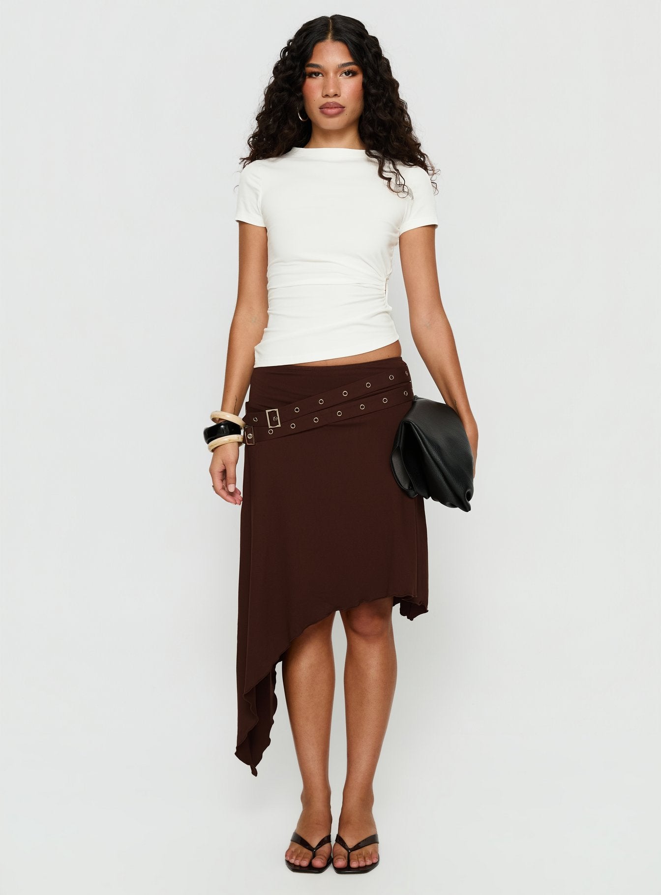 back view of model wearing Princess Polly Lorensa Double Buckle Asymmetrical Midi Skirt Brown Midi Skirts 