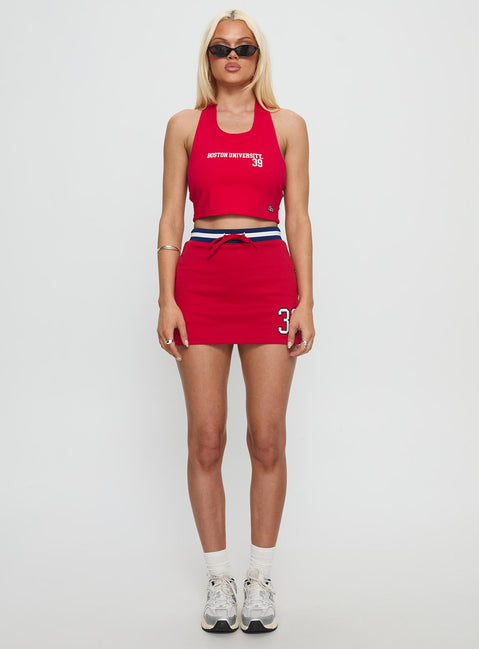   side view of model wearing Princess Polly Boston University Basketball Skirt Red Mini Skirts 
