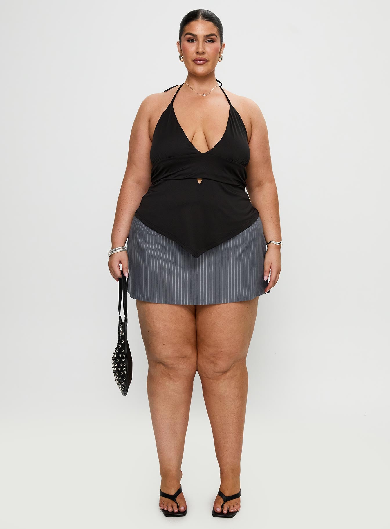 front view of model wearing Princess Polly Averee Halter Top Black Curve Sleeveless Plunger 