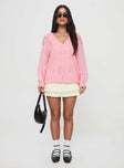 back view of model wearing Princess Polly Sezza Cable Knit Cardigan Baby Pink Long 