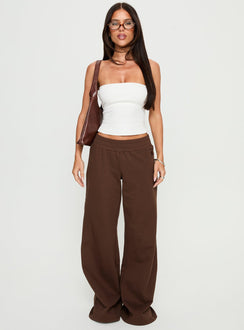 front view of model wearing Princess Polly Summits Flared Track Pants Chocolate High Rise Pants 